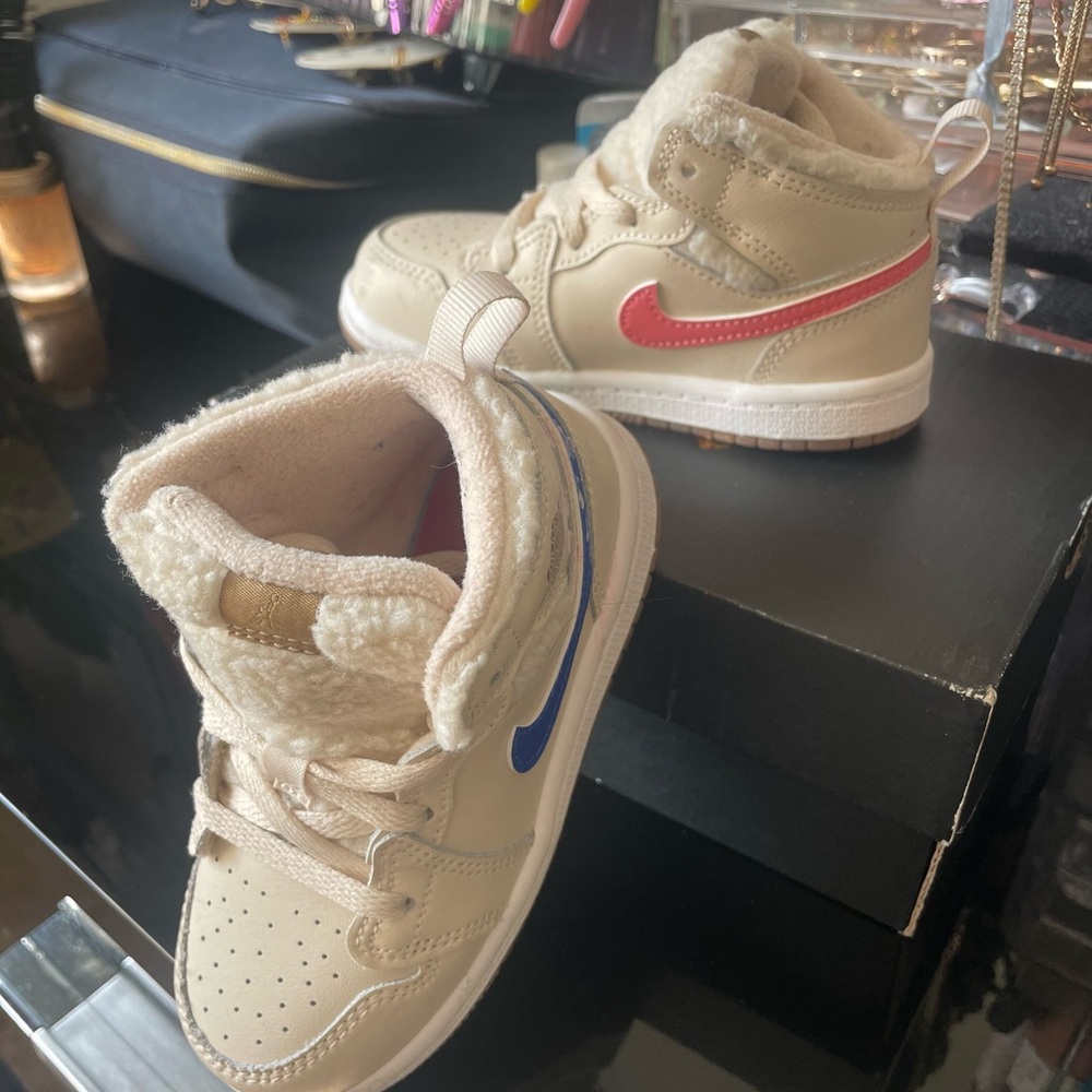 Kids Cream and Multicolored high- top Jordan 1’s with fleece